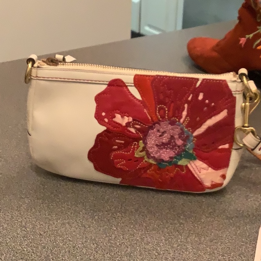 Coach wristlet purse with rose leather appliqué